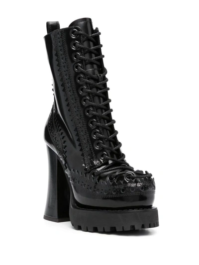 Shop Moschino Boots In Black