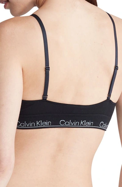 Shop Calvin Klein Naturals Modern Seamless Lightly Lined Triangle Bralette In Black