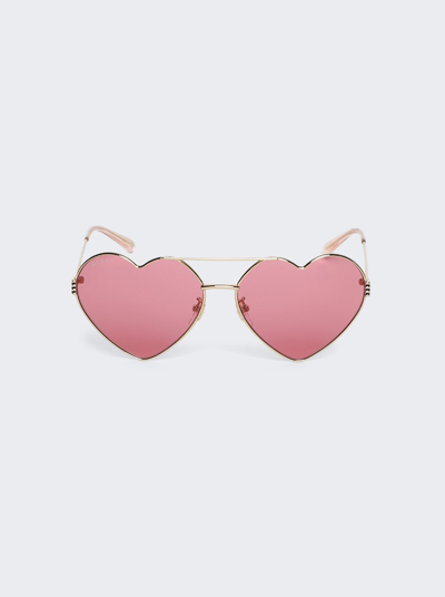 Shop Gucci Heart Shaped Sunglasses In Gold