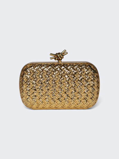 Shop Bottega Veneta Knot Metallic Intreccio Clutch In Gold