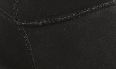 Bearpaw Shorty Genuine Shearling Lined Bootie In Black