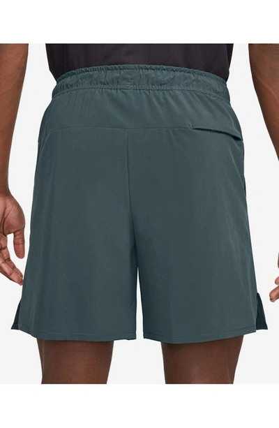 Shop Nike Dri-fit Unlimited 7-inch Unlined Athletic Shorts In Deep Jungle