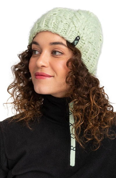 Shop Roxy Winter Cable Knit Pompom Beanie In Cameo Green