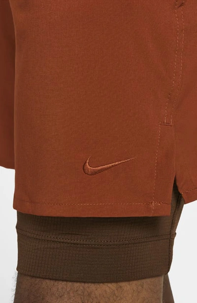 Shop Nike Dri-fit Unlimited 2-in-1 Versatile Shorts In Rugged Orange/ Cacao Wow