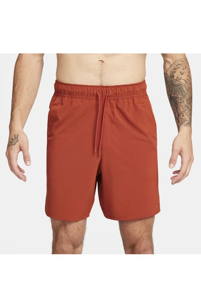 Shop Nike Dri-fit Unlimited 7-inch Unlined Athletic Shorts In Rugged Orange