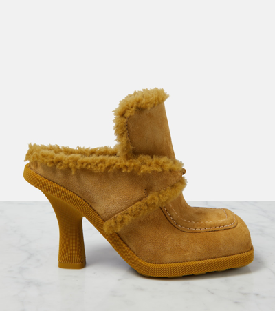 Shop Burberry Ekd Shearling-lined Suede Mules In Yellow