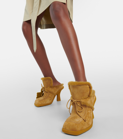 Shop Burberry Ekd Shearling-lined Suede Mules In Yellow