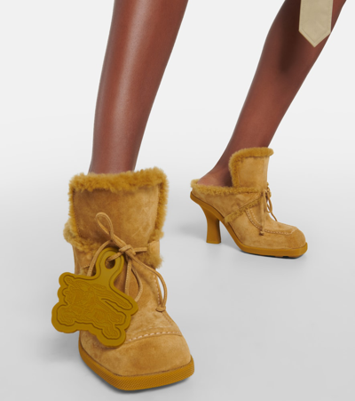 Shop Burberry Ekd Shearling-lined Suede Mules In Yellow