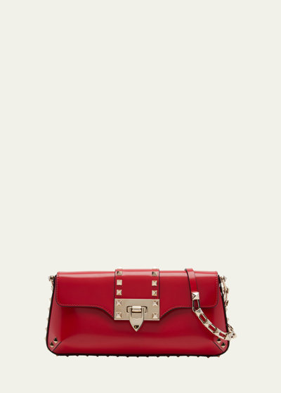 Shop Valentino Rockstud Small Leather Clutch Bag In Rouge Pur