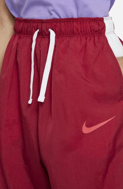 Shop Nike Kids' Sportswear Side Stripe Track Pants In Noble Red/ White/ Ember