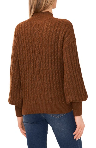 Shop Cece Mock Neck Cable Stitch Sweater In Toasted Brown