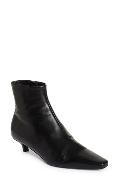 Shop Totême The Slim Ankle Boot In Black