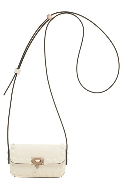 Shop Valentino Mini Rockstud23 Leather Crossbody Bag In 098 Ivory