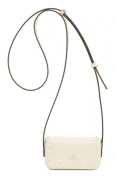 Shop Valentino Mini Rockstud23 Leather Crossbody Bag In 098 Ivory