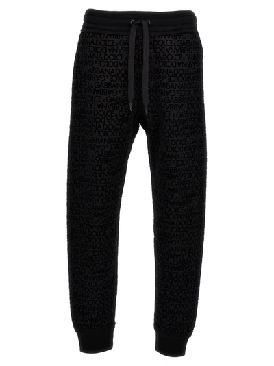 Shop Dolce & Gabbana Flocked Logo Joggers Pants Black