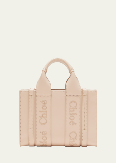 Shop Chloé Woody Mini Tote Bag In Linen With Crossbody Strap In Cement Pink
