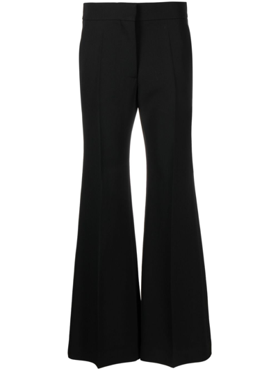 Shop Givenchy Wool Flared Trousers In Black