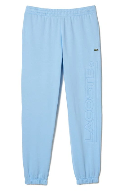 Shop Lacoste Logo Embossed Sweatpants In Blue Panorama