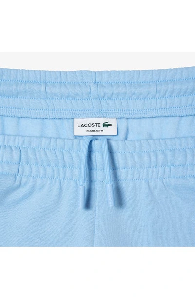 Shop Lacoste Logo Embossed Sweatpants In Blue Panorama