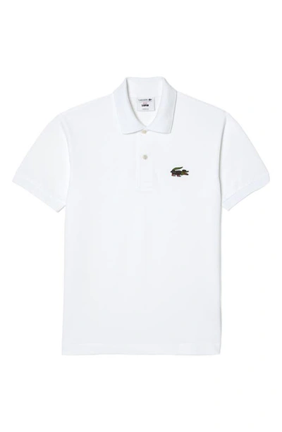 Shop Lacoste Classic Fit Piqué Polo In White/ Serie Lupin