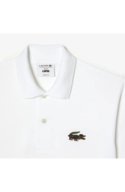 Shop Lacoste Classic Fit Piqué Polo In White/ Serie Lupin
