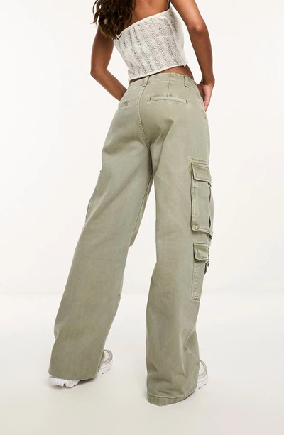 Shop Asos Design Low Rise Wide Leg Cargo Pants In Khaki