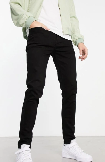 Shop Asos Design Skinny Jeans In Black