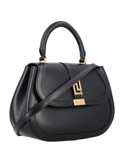 Shop Versace Greca Goddess Top Handle Bag In Nero E Oro