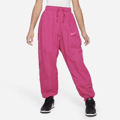 Shop Nike Sportswear Big Kids' (girls') Woven Pants In Pink