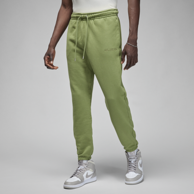 Shop Jordan Men's  Wordmark Fleece Pants In Green