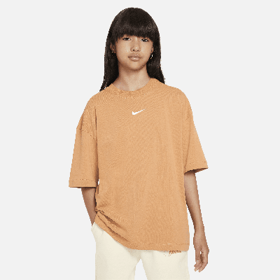 Shop Nike Sportswear Premium Essentials Big Kids' (girls') Oversized T-shirt In Brown