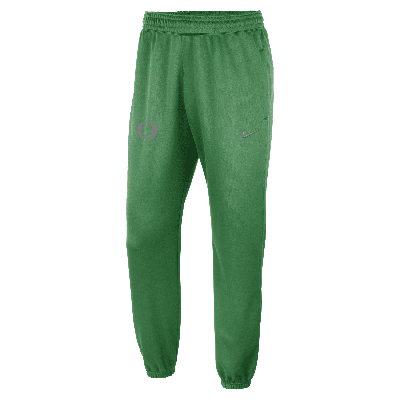 Shop Nike Men's College Dri-fit Spotlight (oregon) Pants In Green