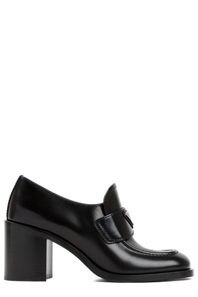 Shop Prada Logo Patch Heeled Loafers In Black