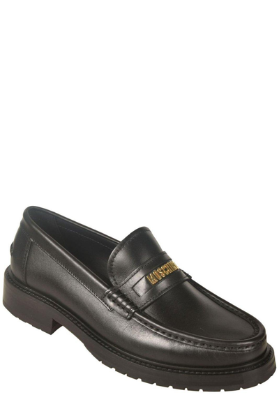 Shop Moschino Logo-lettering Slip-on Loafers In Nero