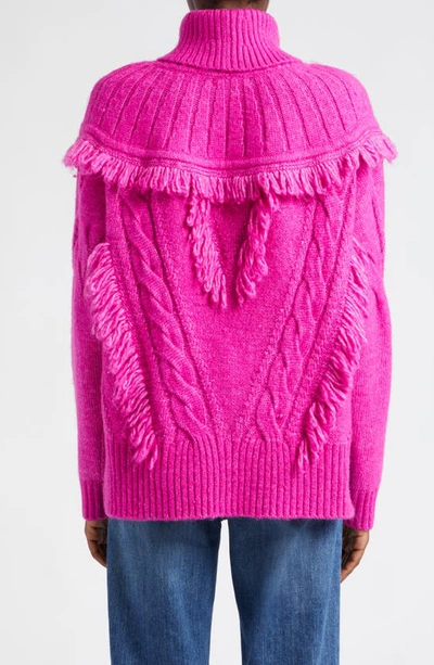 Shop Ramy Brook Mya Cable Stitch Fringe Turtleneck Sweater In Electric Pink Cable W Fringe
