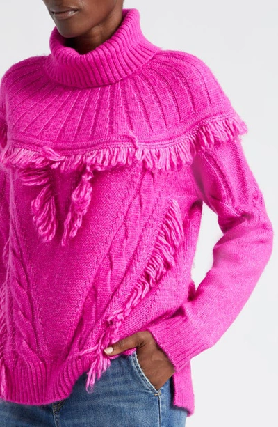 Shop Ramy Brook Mya Cable Stitch Fringe Turtleneck Sweater In Electric Pink Cable W Fringe