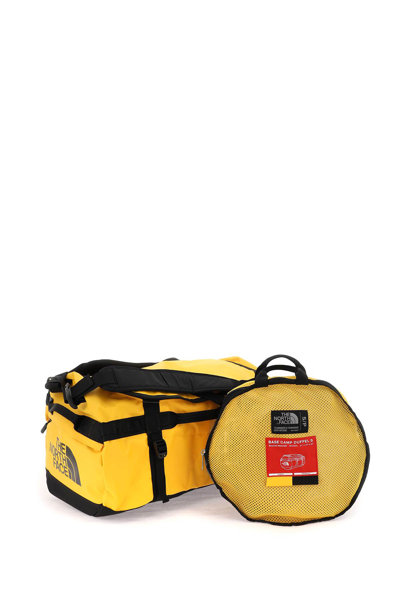 Shop The North Face Small Base Camp Duffel Bag In Summit Gold Tnf Black (yellow)
