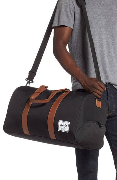 Shop Herschel Supply Co. Duffle Bag In Black/ Tan