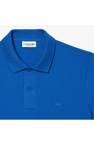 Shop Lacoste Solid Stretch Cotton Blend Polo Shirt In Kingdom