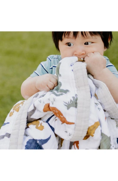 Little Unicorn Cotton Muslin Baby Quilt In Dino Friends
