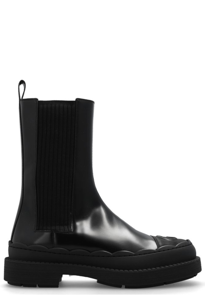 Shop Gucci Gg Debossed Ankle Boots In Black