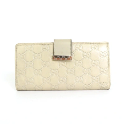 Shop Gucci -- Beige Leather Wallet  ()