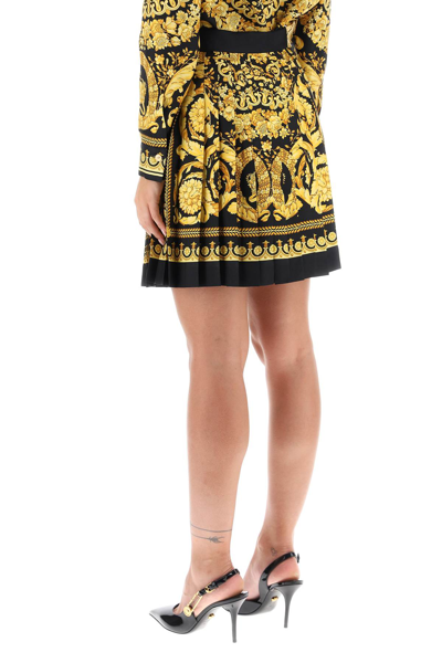 Shop Versace Barocco Pleated Mini Skirt In Black Gold (yellow)