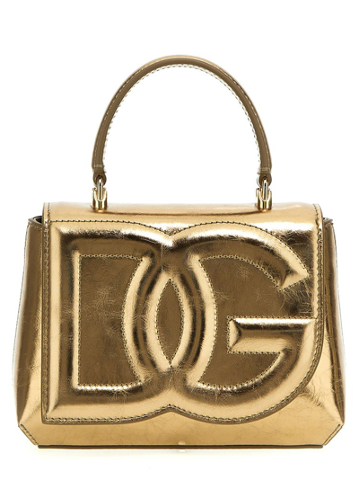 Shop Dolce & Gabbana Dg Logo Embossed Fold In Gold