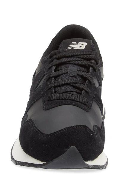 Shop New Balance Gender Inclusive 574 Sneaker In Black/ Pink