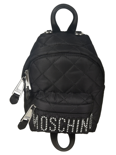 Shop Moschino Logo Embellished Quilted Backpack In 3555