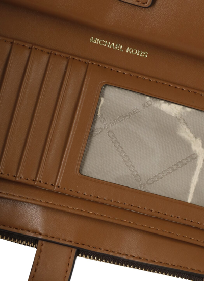 Shop Michael Michael Kors Jet Set Wallet In Brown