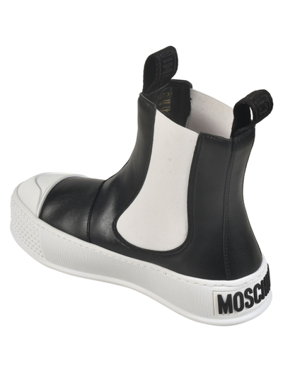 Shop Moschino Side Stretch Boots In Black