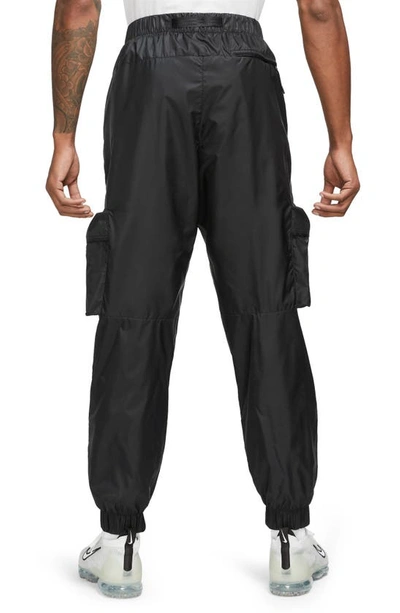 Shop Nike Lined Woven Cargo Joggers In Black/ Black