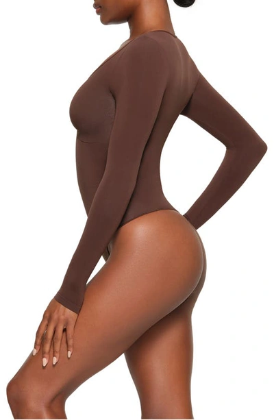 Shop Skims Seamless Sculpt Long Sleeve Thong Bodysuit In Cocoa